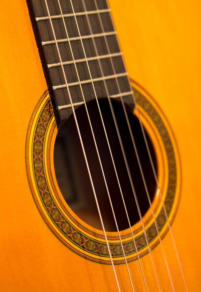 Detailed view of a classic acoustic guitar with intricate design.